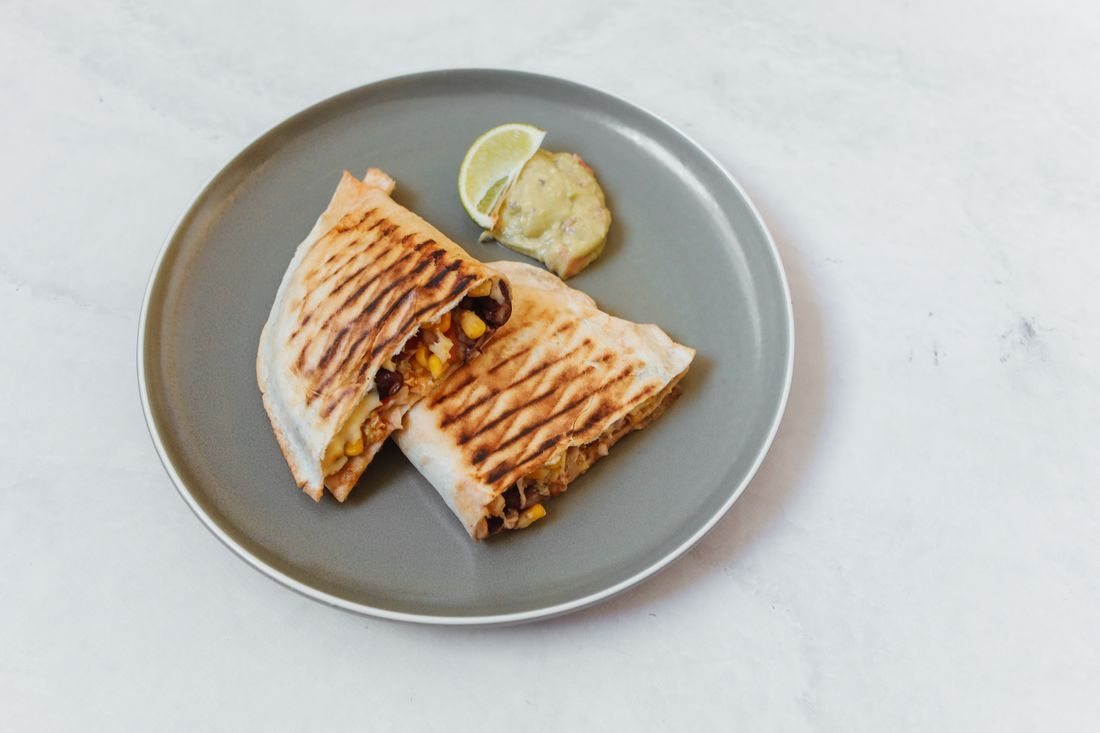Toasted quesadilla pieces on a plate