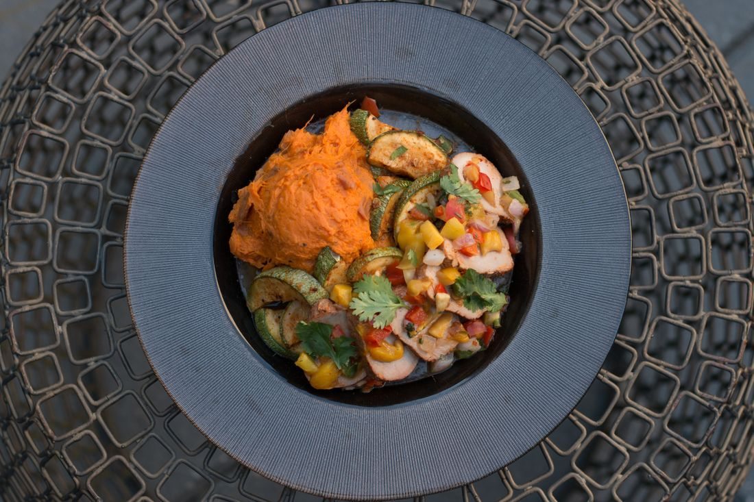 Orange vegetable mash served with vegetables